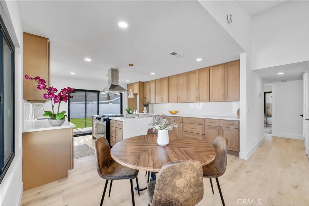4672 Ranchgrove Drive Irvine, CA 92604 - Photo 1 of 1 a view of a dining room with furniture and a potted plant