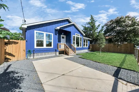 an aerial view of houses with outdoor space