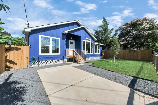 an aerial view of houses with outdoor space