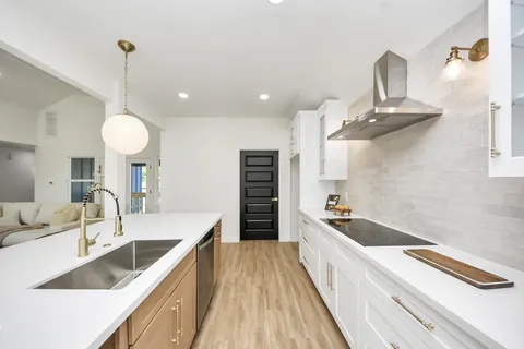 a kitchen with a sink and cabinets