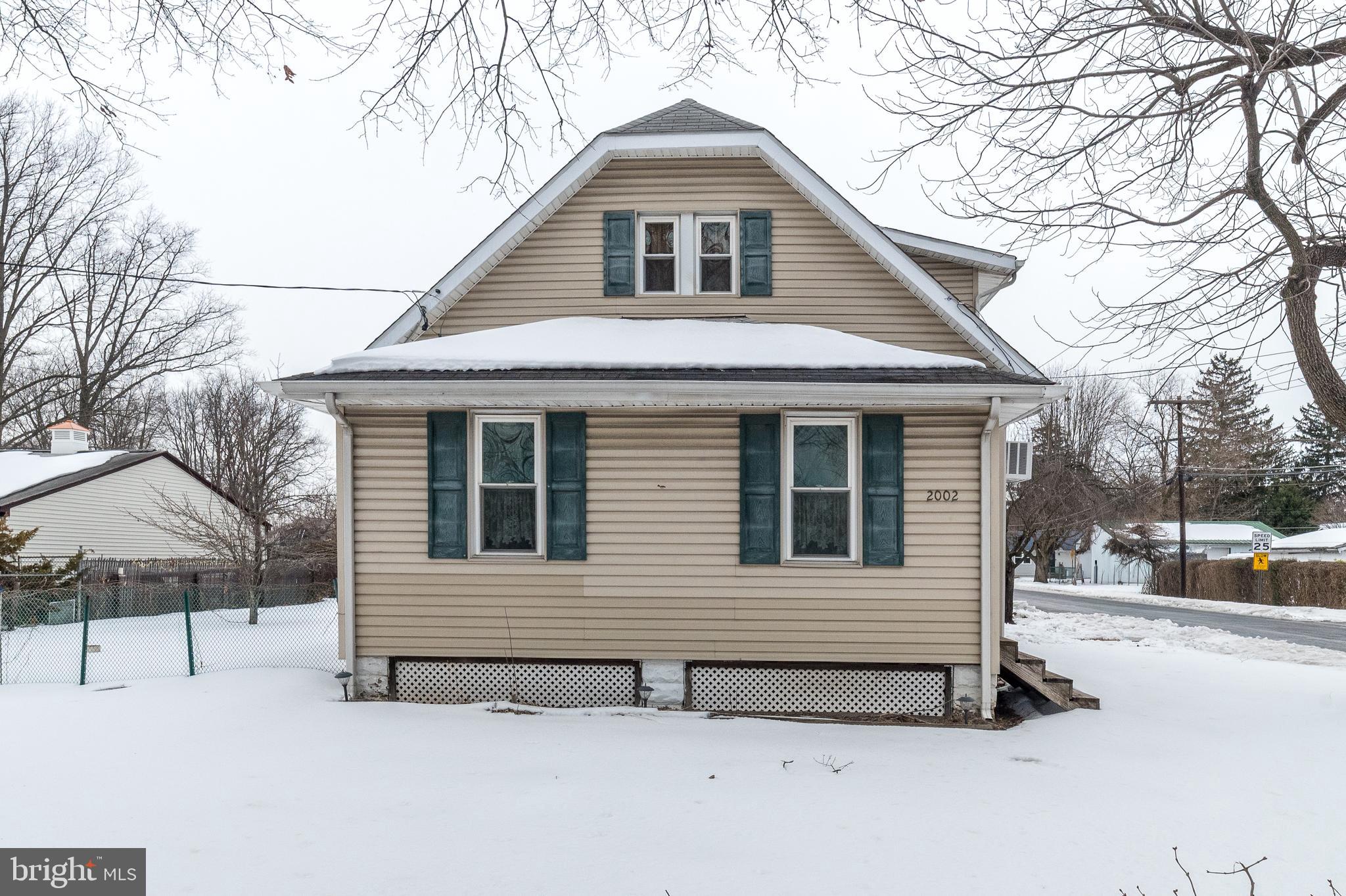 2002 Edgely Road Levittown, PA 19057 - Photo 6 of 25 a view of house with outdoor space and parking