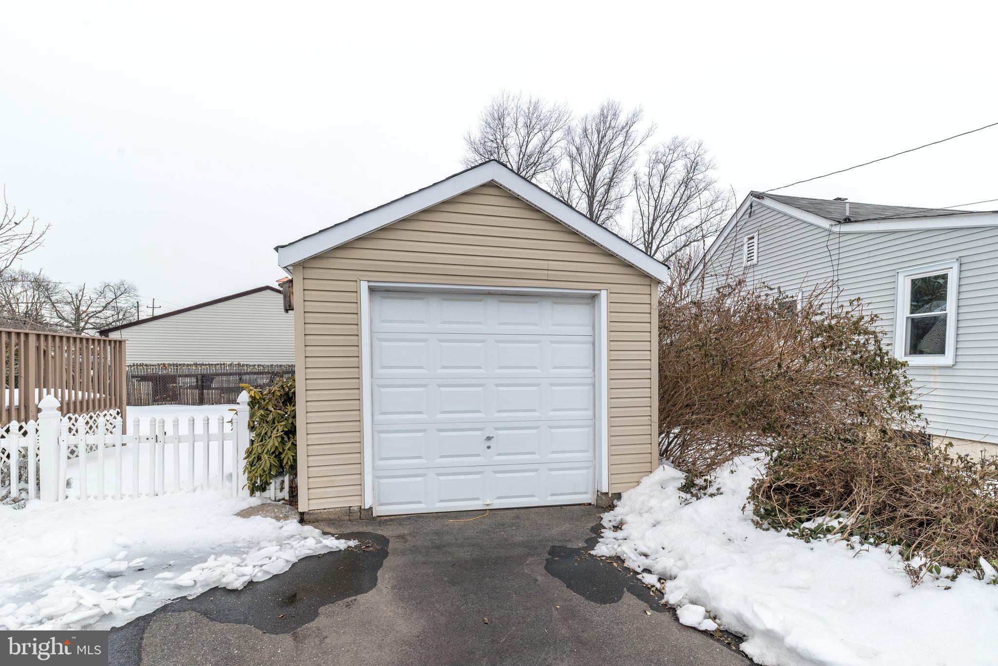 2002 Edgely Road Levittown, PA 19057 - Photo 7 of 25 a front view of a house with a garage