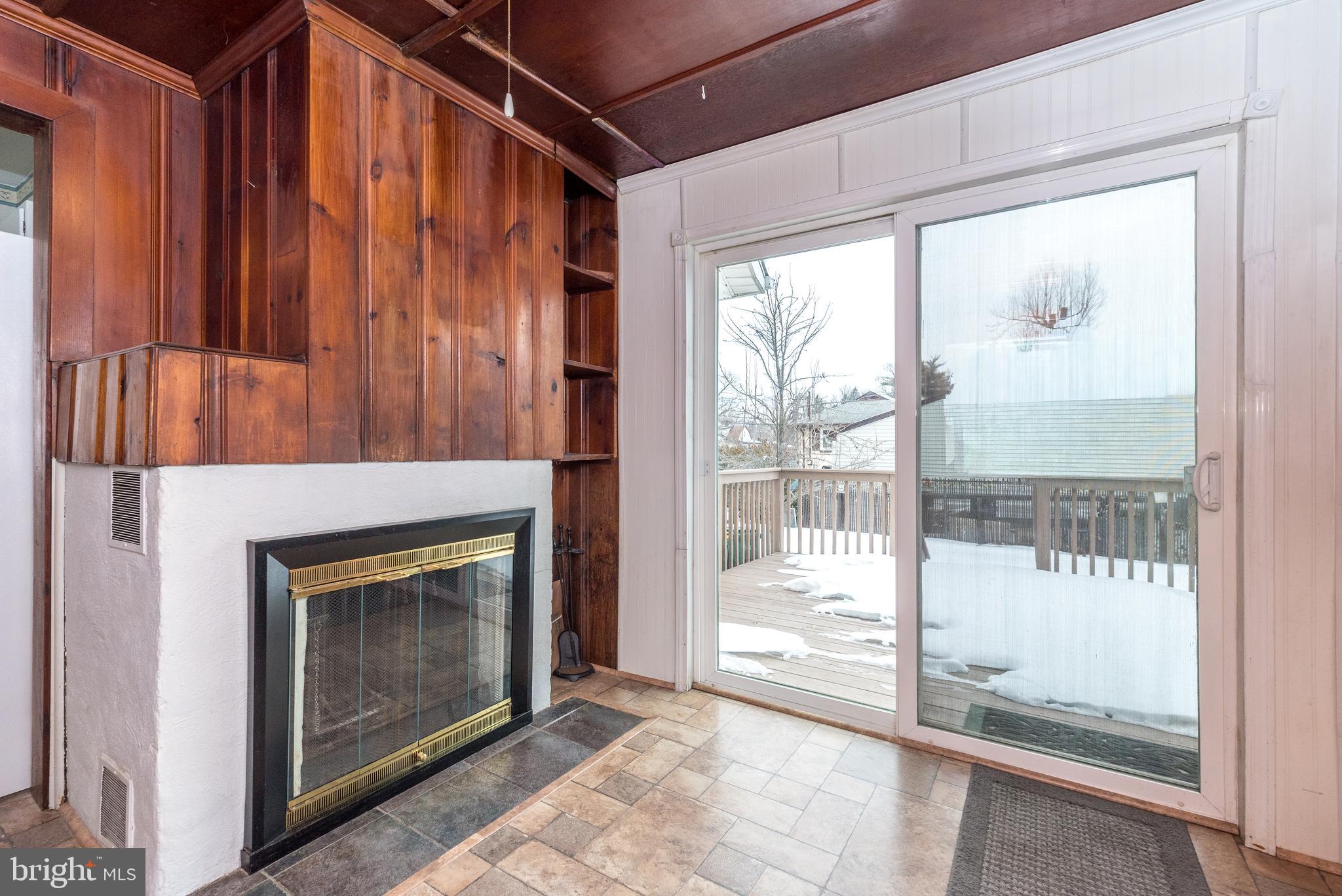 2002 Edgely Road Levittown, PA 19057 - Photo 10 of 25 a living room with a fireplace and a glass door