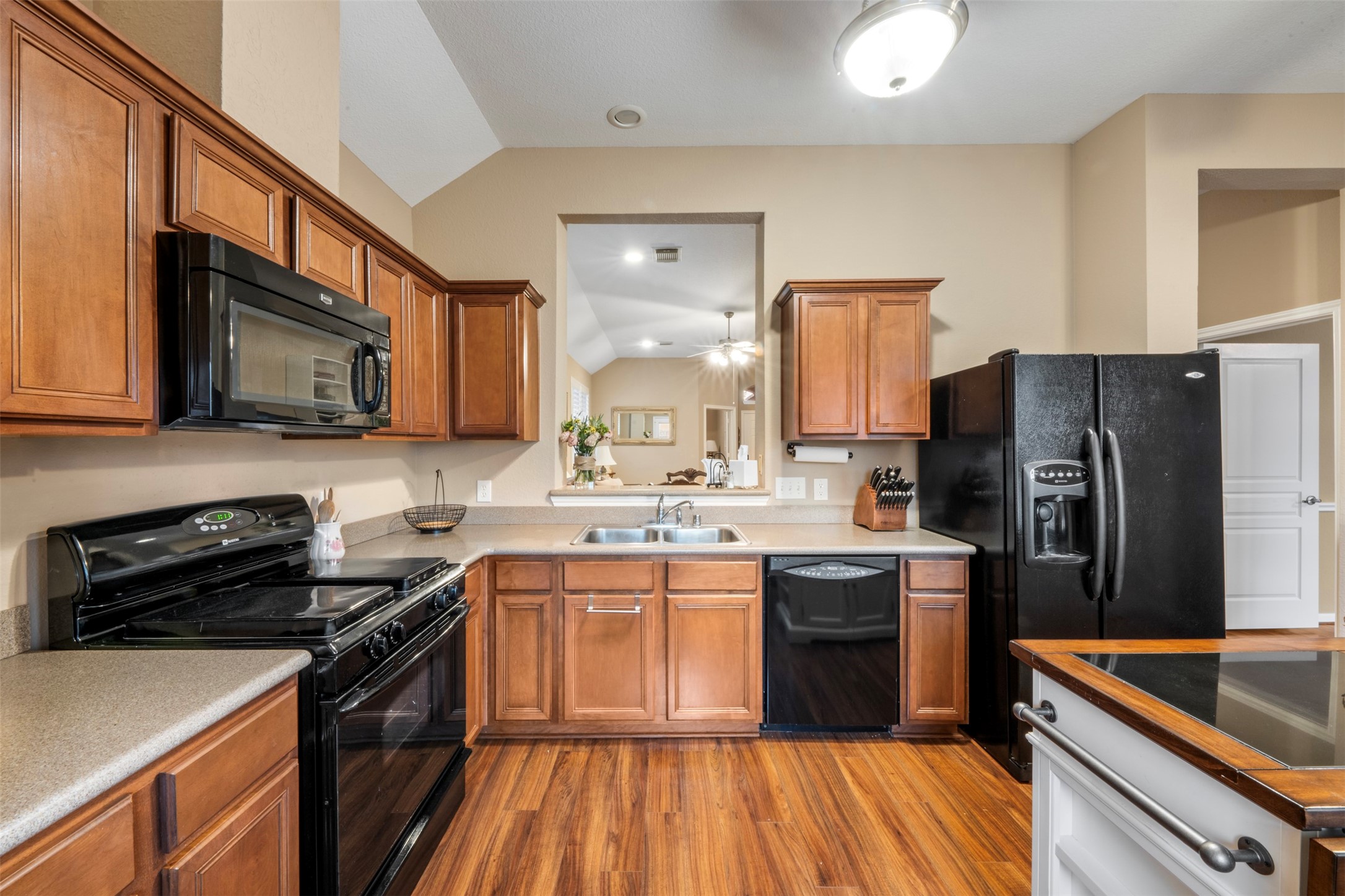9635 Old Timber Lane Spring, TX 77379 - Photo 16 of 48 a kitchen with stainless steel appliances granite countertop a sink stove and refrigerator