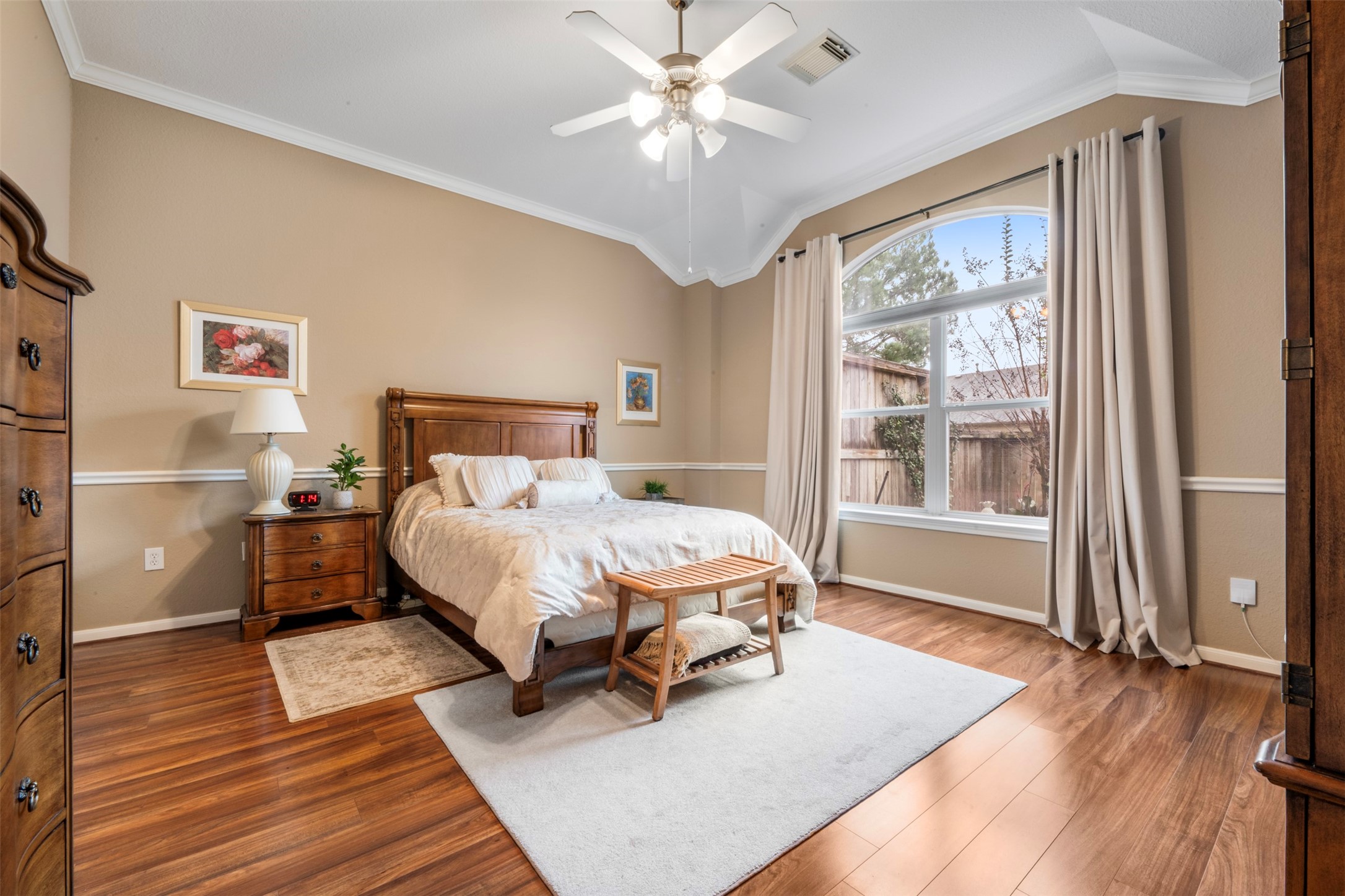 9635 Old Timber Lane Spring, TX 77379 - Photo 17 of 48 a spacious bedroom with a bed and wooden floor