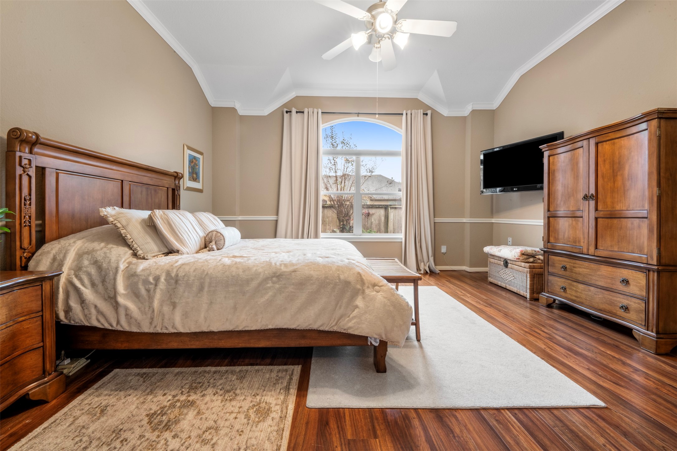 9635 Old Timber Lane Spring, TX 77379 - Photo 18 of 48 a bedroom with a bed a flat screen tv and a couch