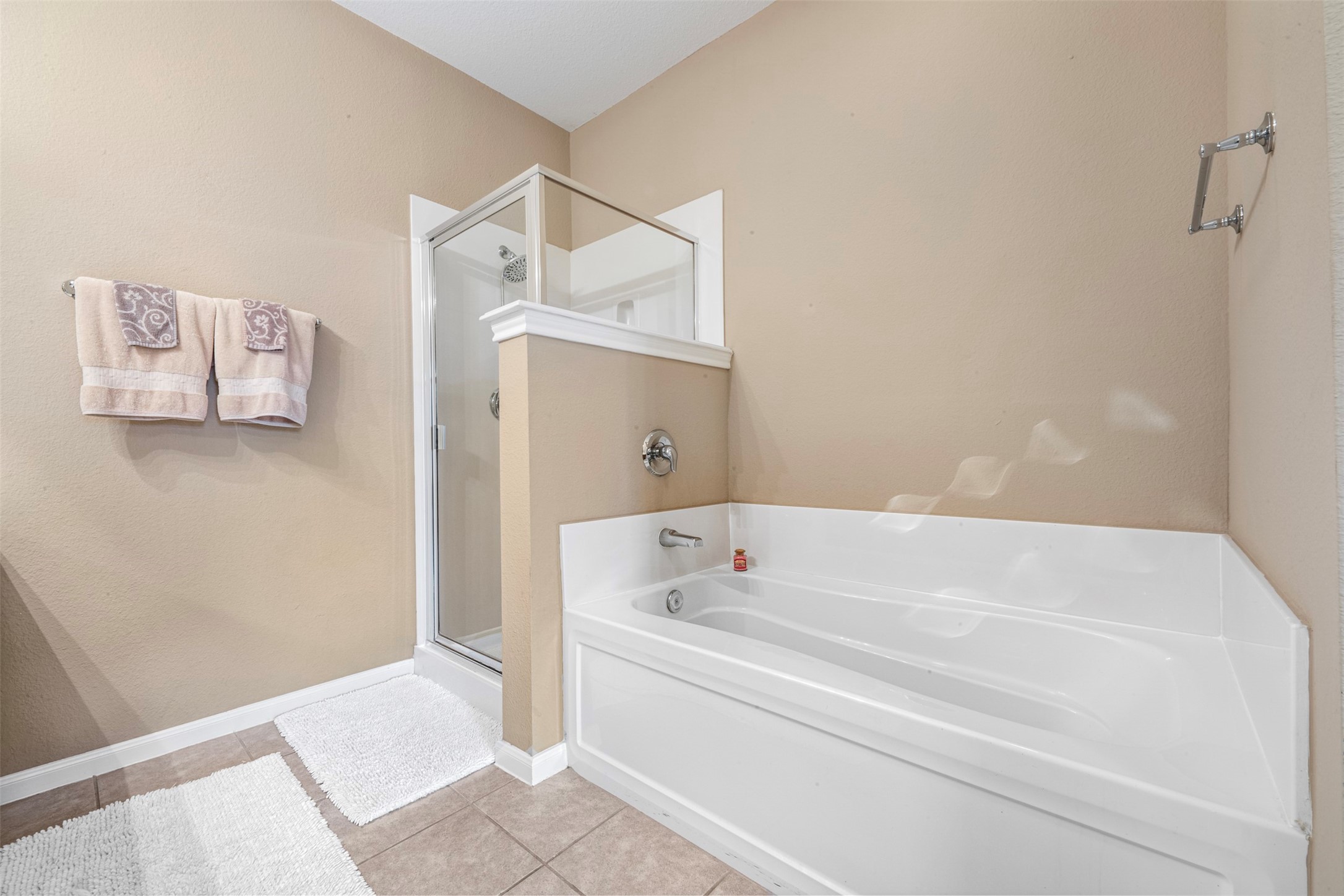 9635 Old Timber Lane Spring, TX 77379 - Photo 21 of 48 a bathroom with a bathtub and shower