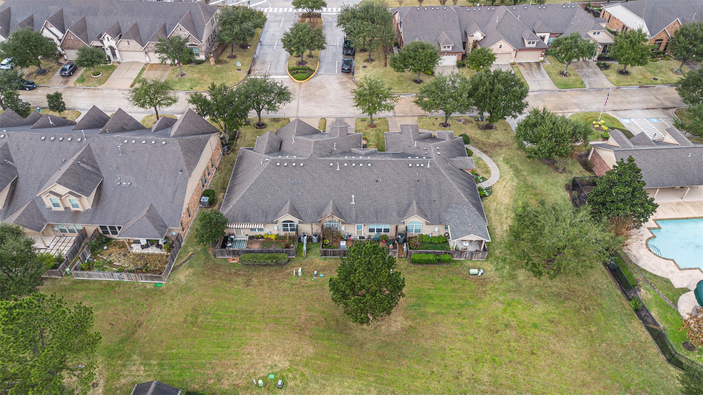 9635 Old Timber Lane Spring, TX 77379 - Photo 36 of 48 an aerial view of a house with swimming pool and outdoor seating
