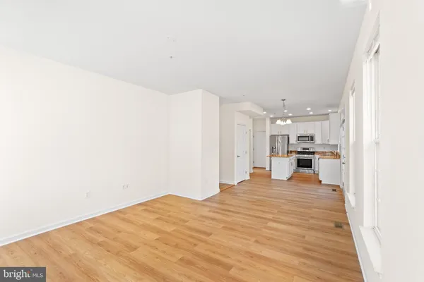 a view of a livingroom with an empty space and a fireplace