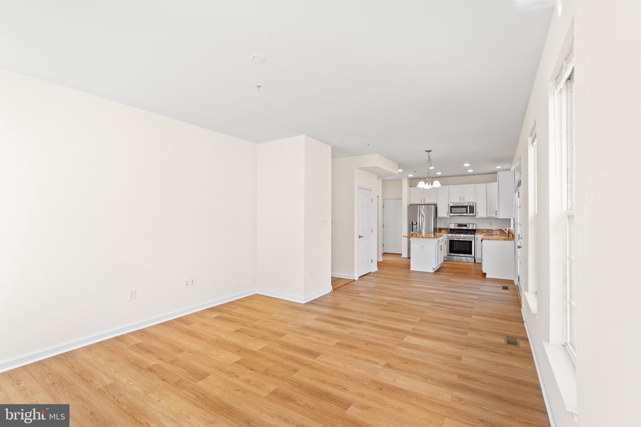 9602 Stuart Lane Clinton, MD 20735 - Photo 11 of 40 a large room with kitchen view