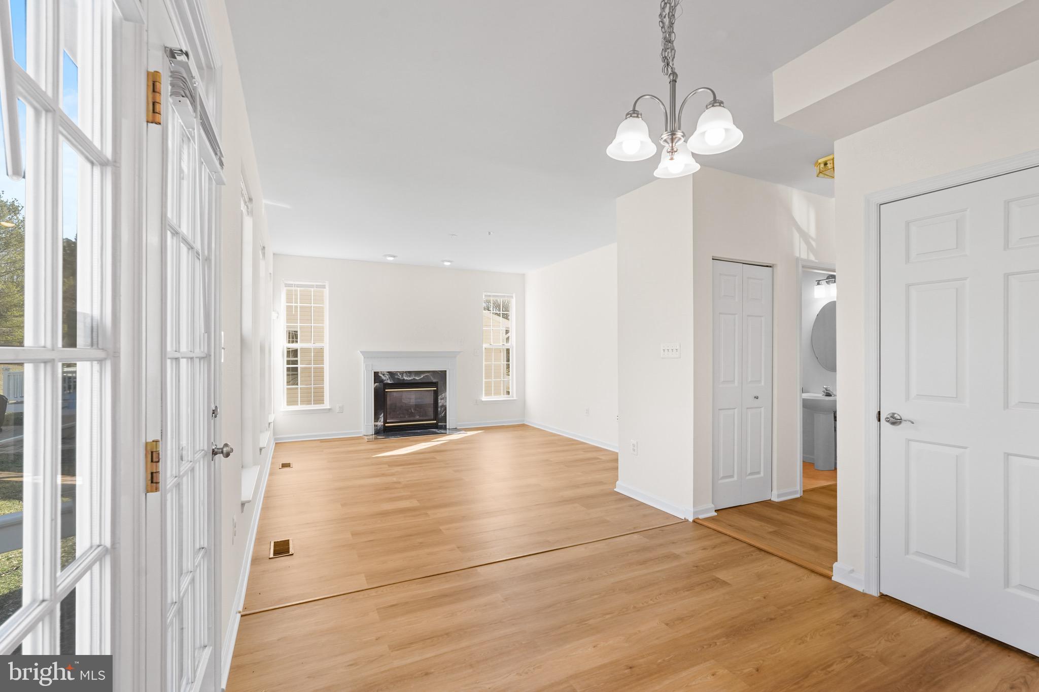 9602 Stuart Lane Clinton, MD 20735 - Photo 12 of 40 a view of a livingroom with an empty space and a fireplace