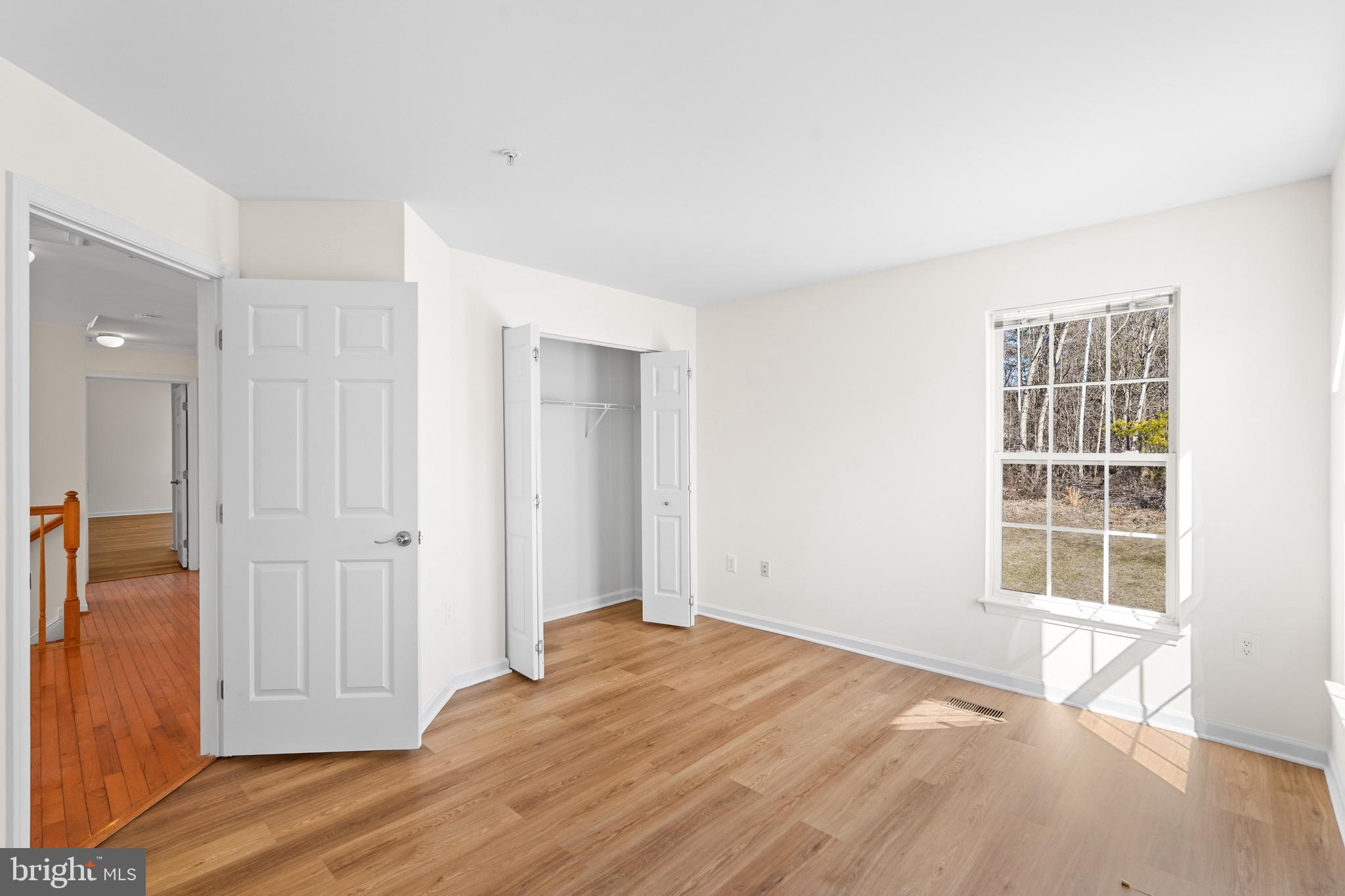 9602 Stuart Lane Clinton, MD 20735 - Photo 20 of 40 wooden floor and windows in a room