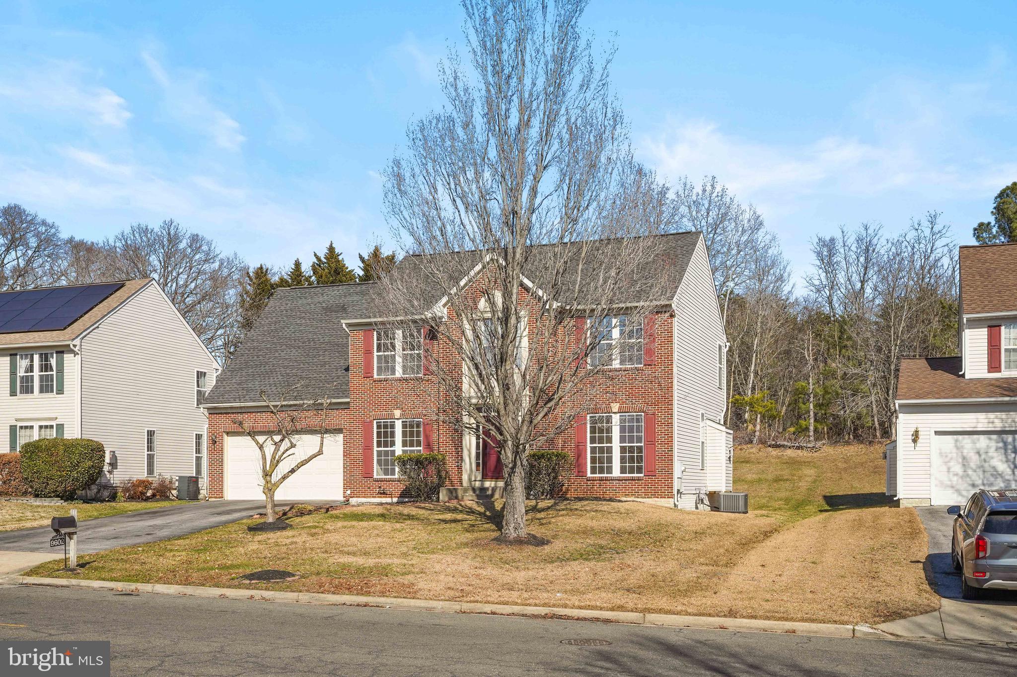9602 Stuart Lane Clinton, MD 20735 - Photo 2 of 40 a view of a house with snow on the road