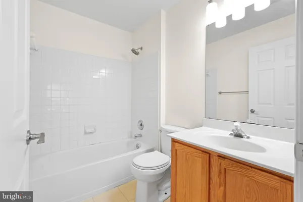 a white toilet sitting next to a window