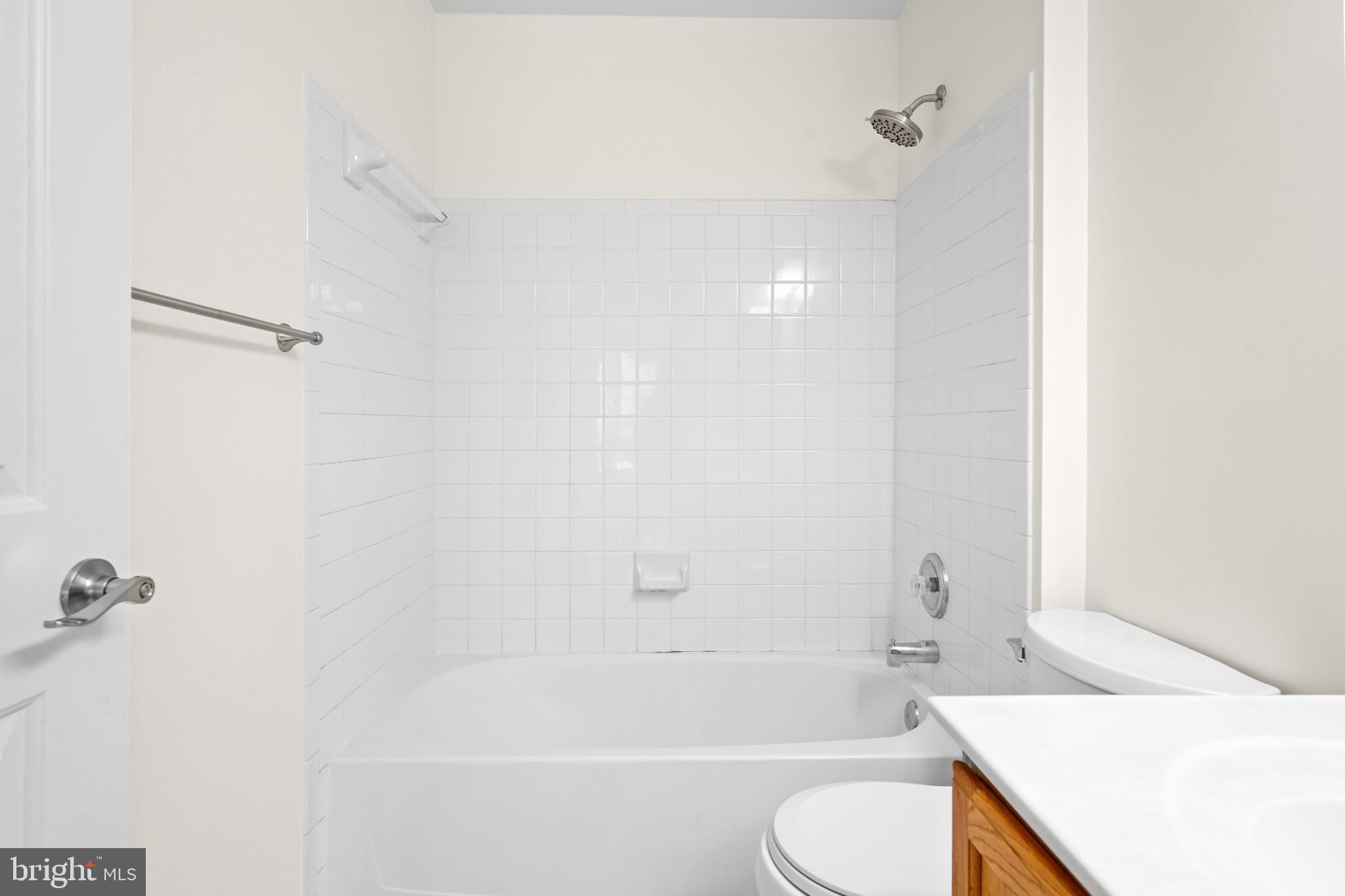 9602 Stuart Lane Clinton, MD 20735 - Photo 25 of 40 a bathroom with a sink toilet and bathtub