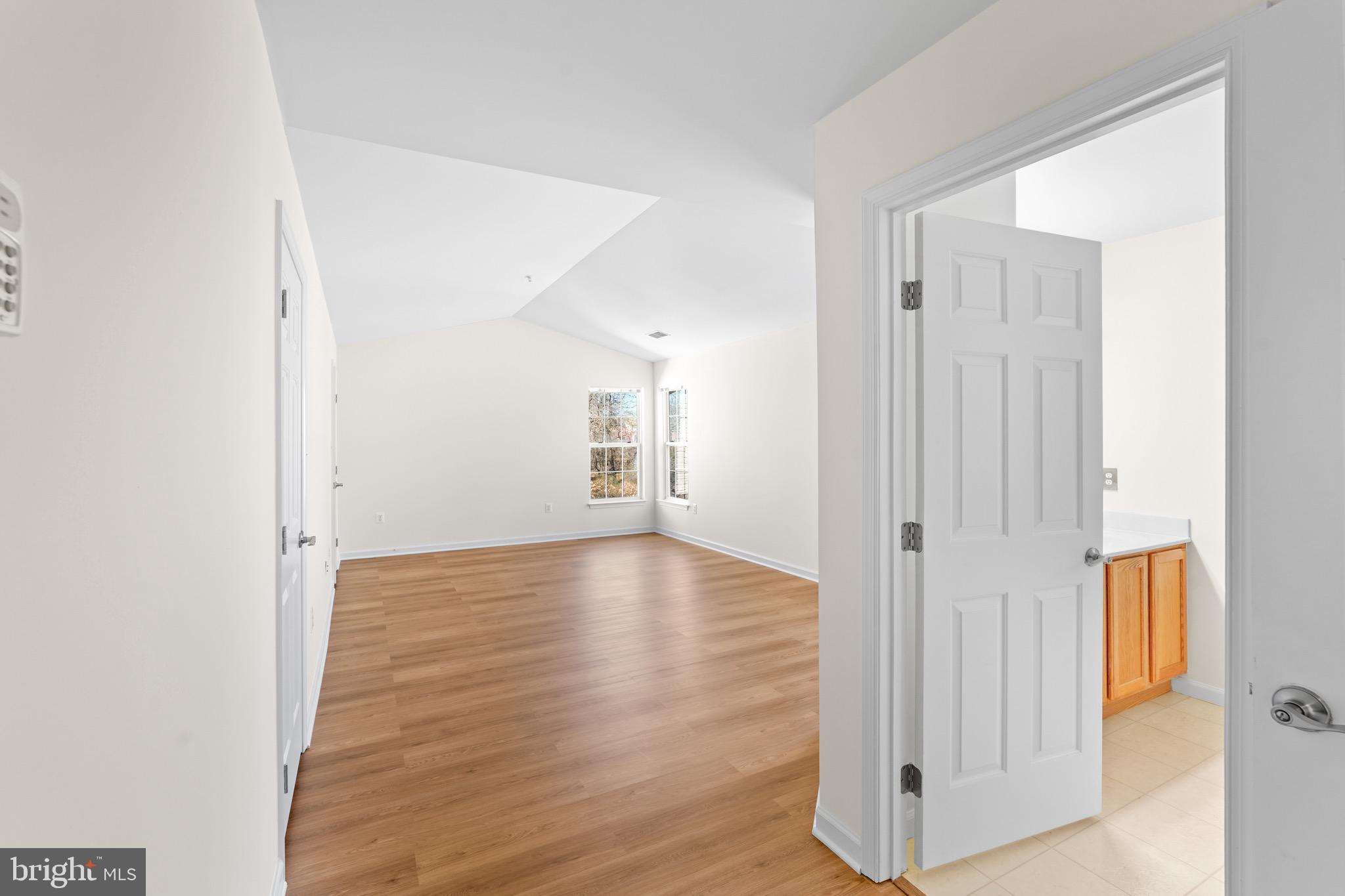 9602 Stuart Lane Clinton, MD 20735 - Photo 26 of 40 a view of empty room with wooden floor