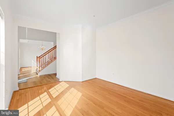 a very nice looking room with a large window and chandelier