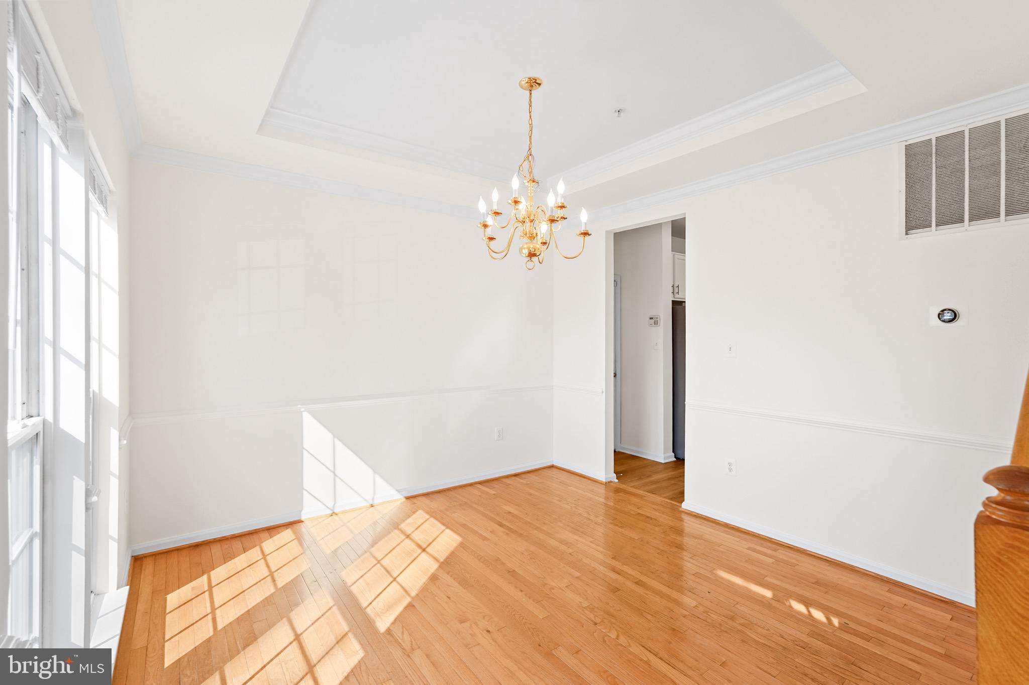 9602 Stuart Lane Clinton, MD 20735 - Photo 8 of 40 a very nice looking room with a large window and chandelier