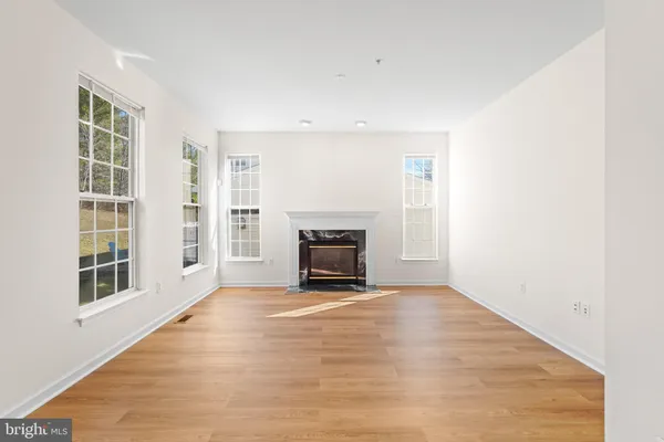 a large room with kitchen view