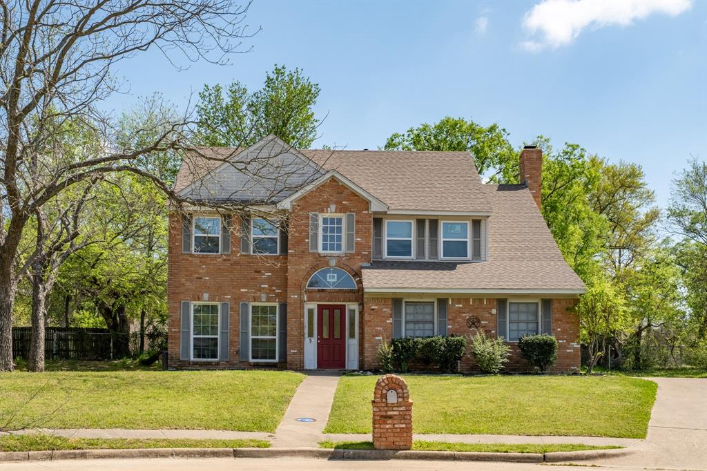 a view of house with yard