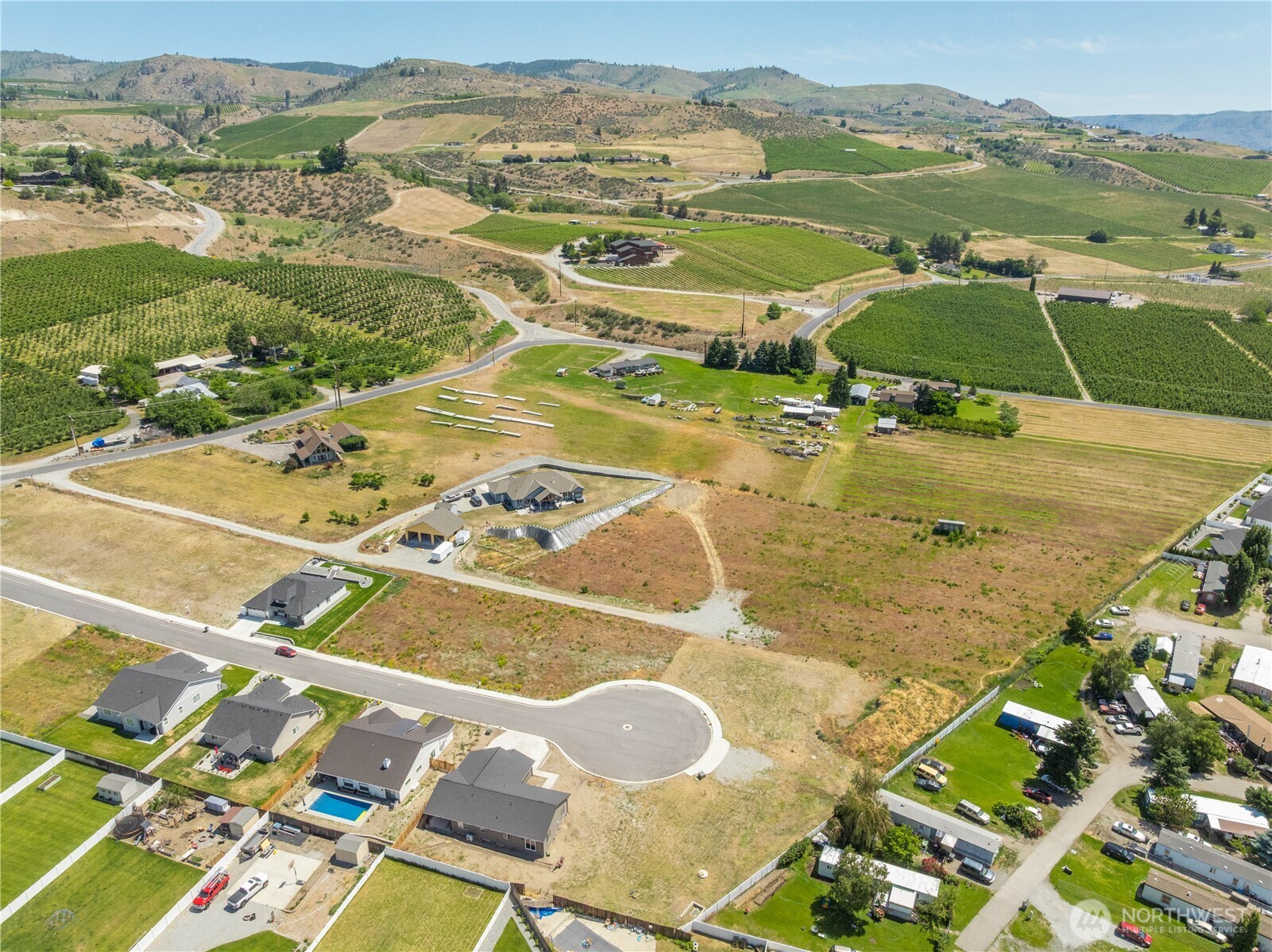 145 Sailing Hawk Lane Manson, WA 98831 - Photo 13 of 37 an aerial view of residential houses with outdoor space