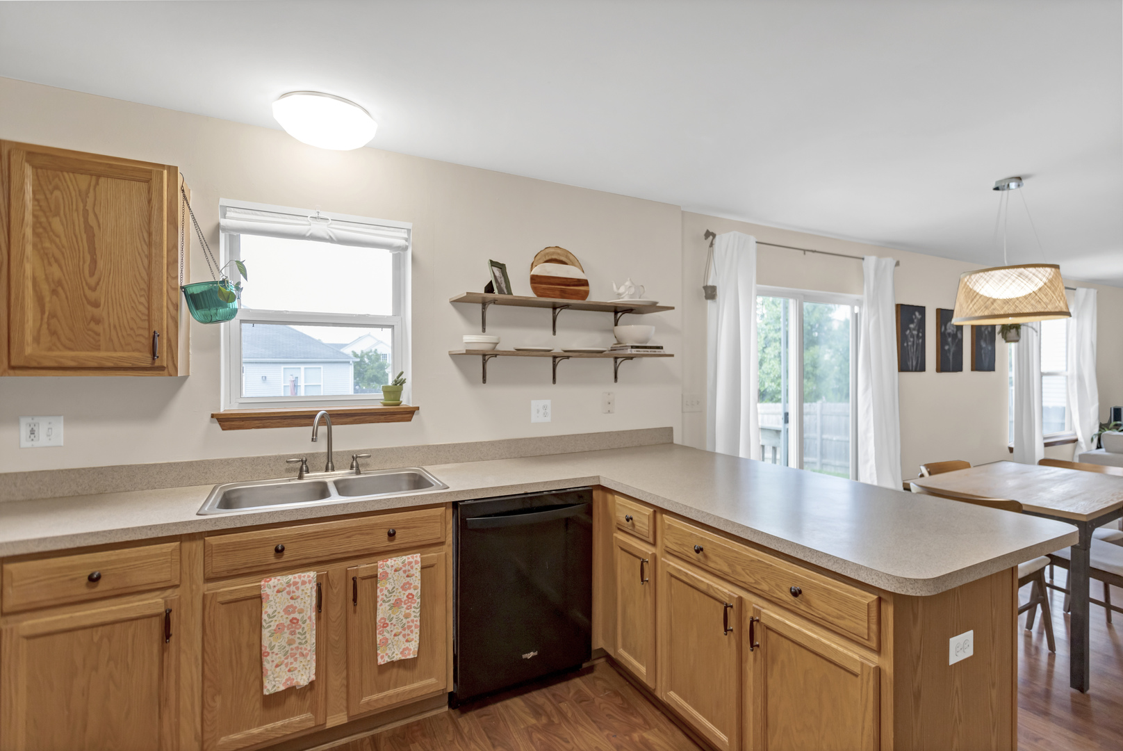 2112 Wicklow Lane Round Lake, IL 60073 - Photo 12 of 34 a kitchen with granite countertop a sink and cabinets