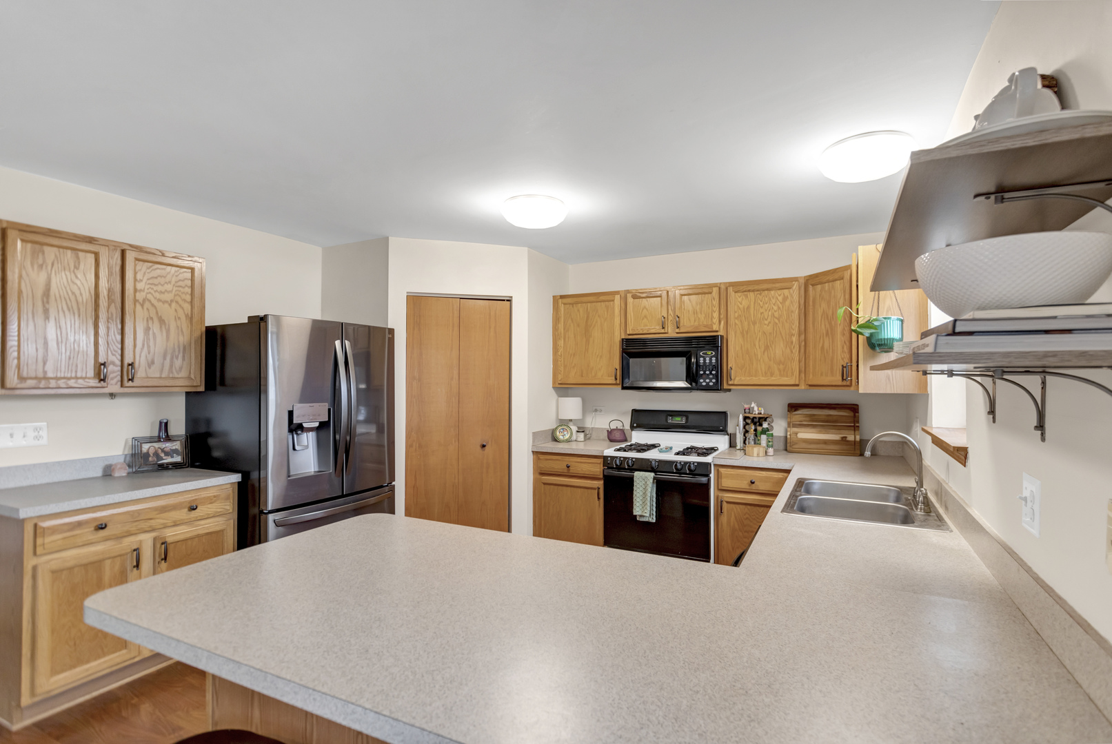 2112 Wicklow Lane Round Lake, IL 60073 - Photo 14 of 34 a kitchen with stainless steel appliances granite countertop a stove refrigerator and a stove