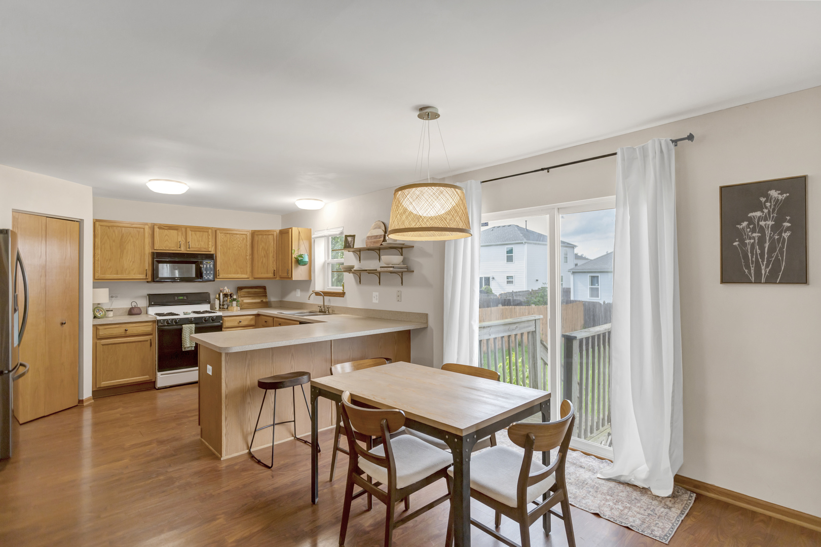 2112 Wicklow Lane Round Lake, IL 60073 - Photo 15 of 34 a kitchen with a table and chairs in it