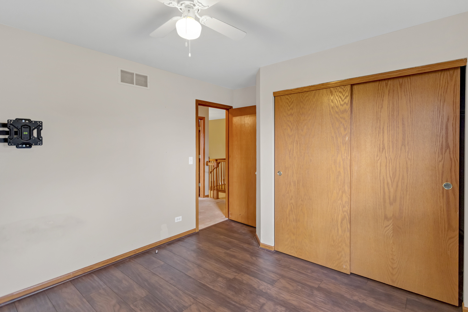 2112 Wicklow Lane Round Lake, IL 60073 - Photo 22 of 34 an empty room with wooden floor and closet