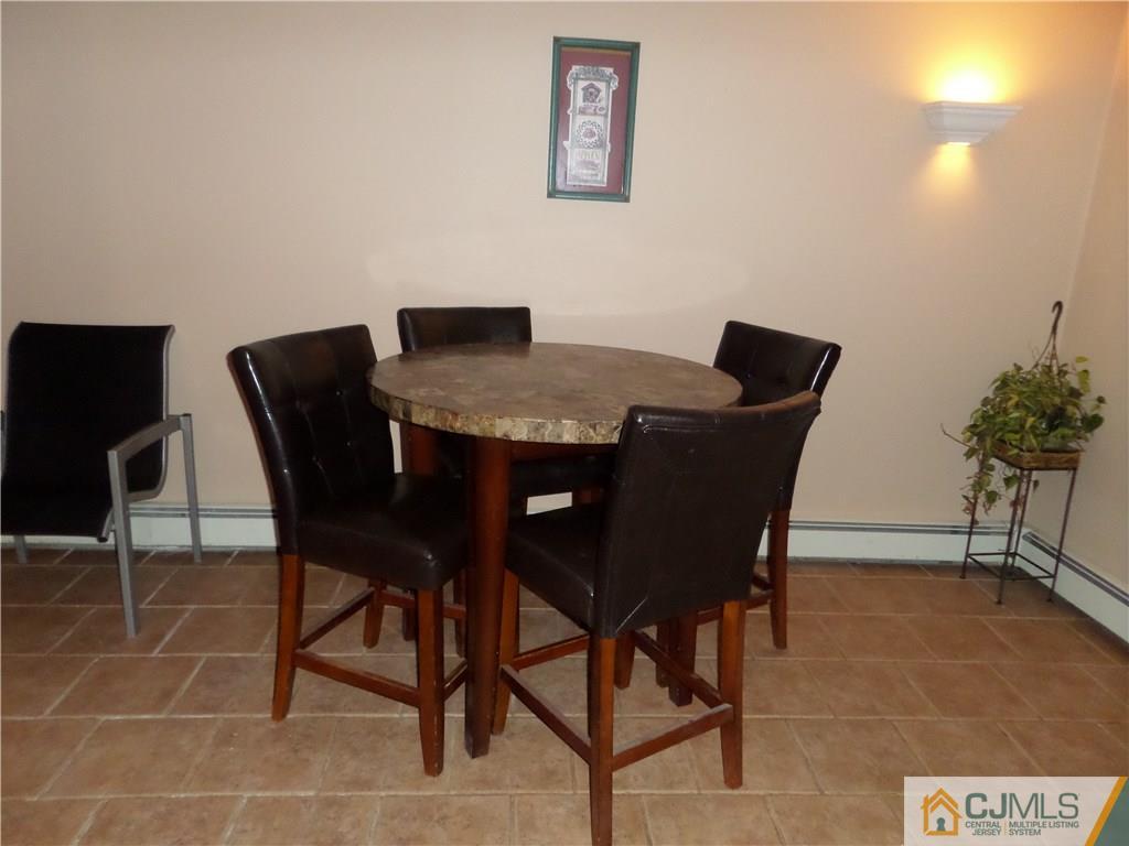 6 Baxter Road Edison, NJ 08817 - Photo 17 of 19 a view of a dining room with furniture and wooden floor