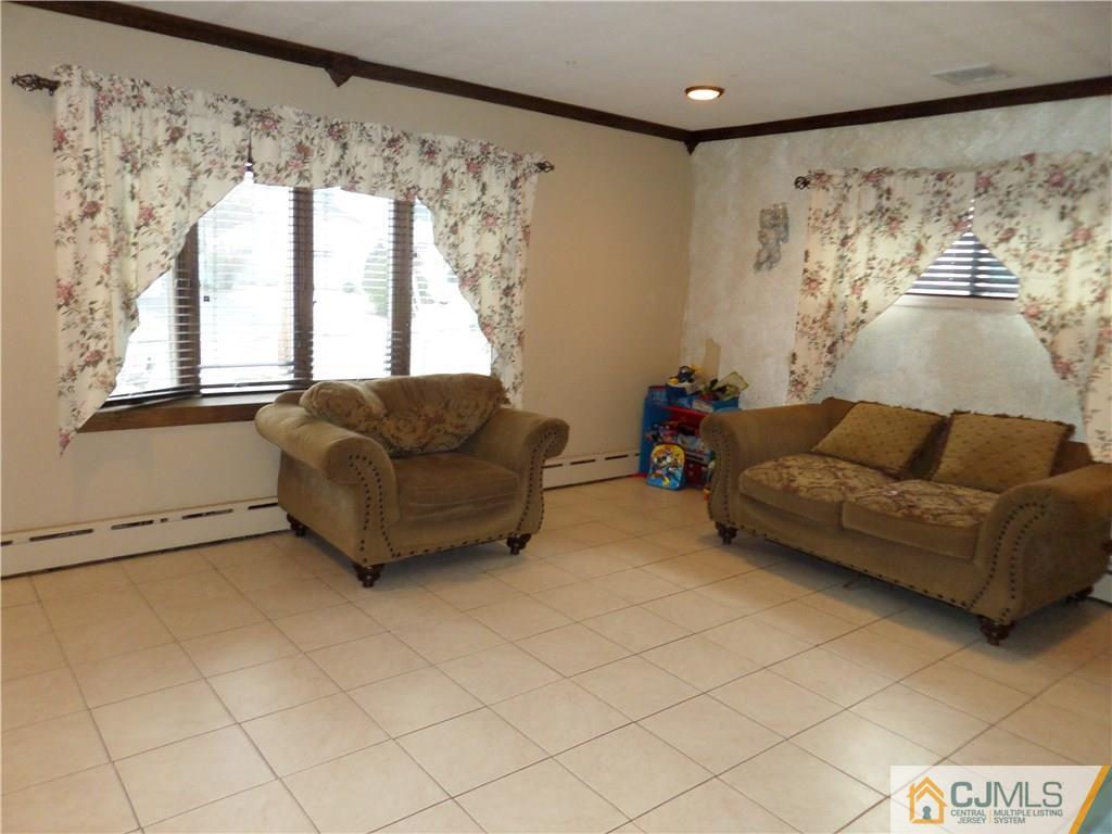6 Baxter Road Edison, NJ 08817 - Photo 6 of 19 a living room with furniture and a large window