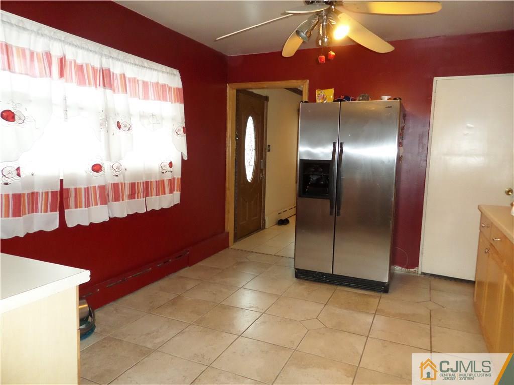 6 Baxter Road Edison, NJ 08817 - Photo 10 of 19 a kitchen with a refrigerator and chandelier