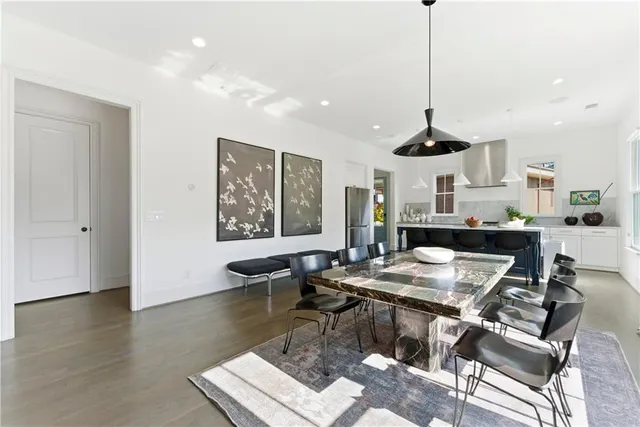 a living room with fireplace furniture and a large window