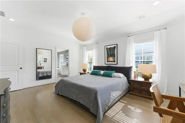 a spacious bathroom with a double vanity sink mirror and double