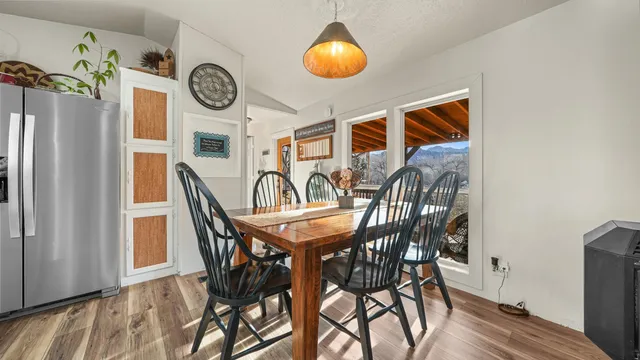 a dining room with furniture and window