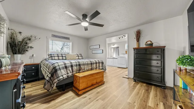 a bedroom with a bed and a dresser