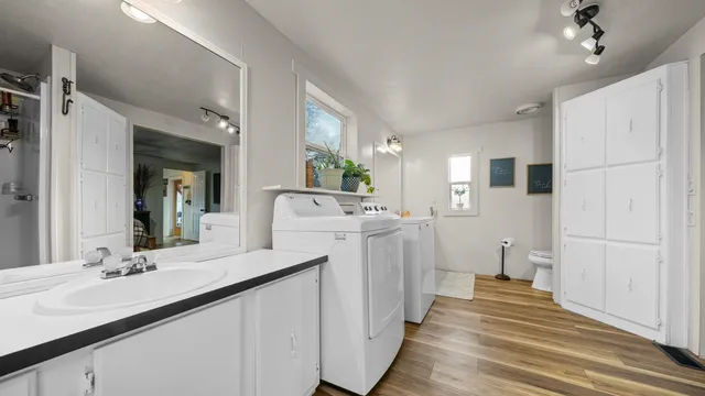 a bathroom with a sink a mirror and a toilet