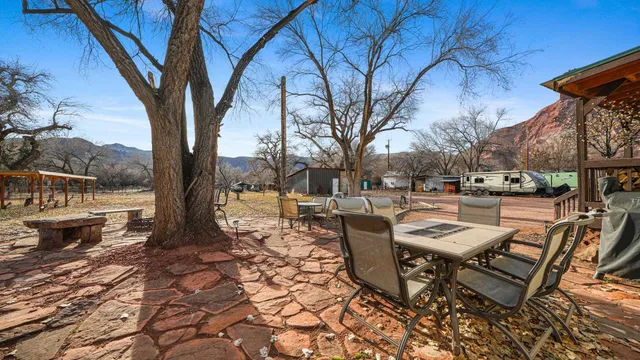 a view of a patio with a yard