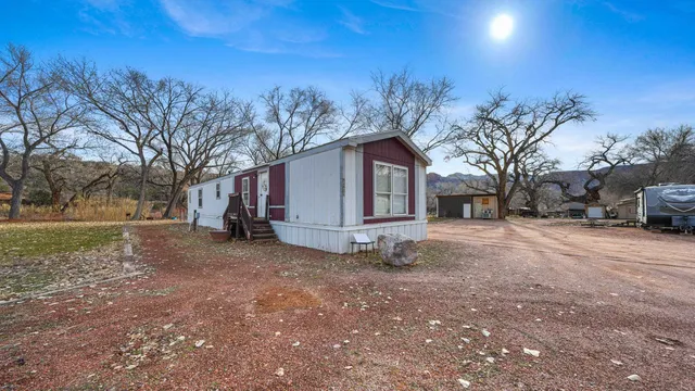 a view of a house with a yard and garage