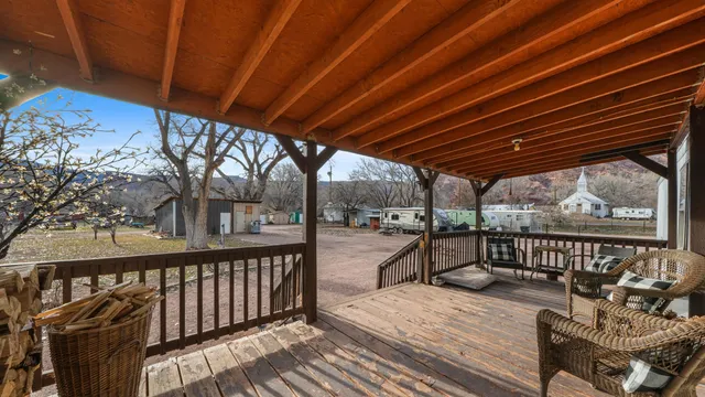 a view of a roof deck with wooden fence