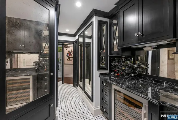 a kitchen with lots of wooden cabinets