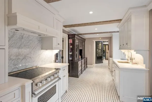 a kitchen with a stove and a sink