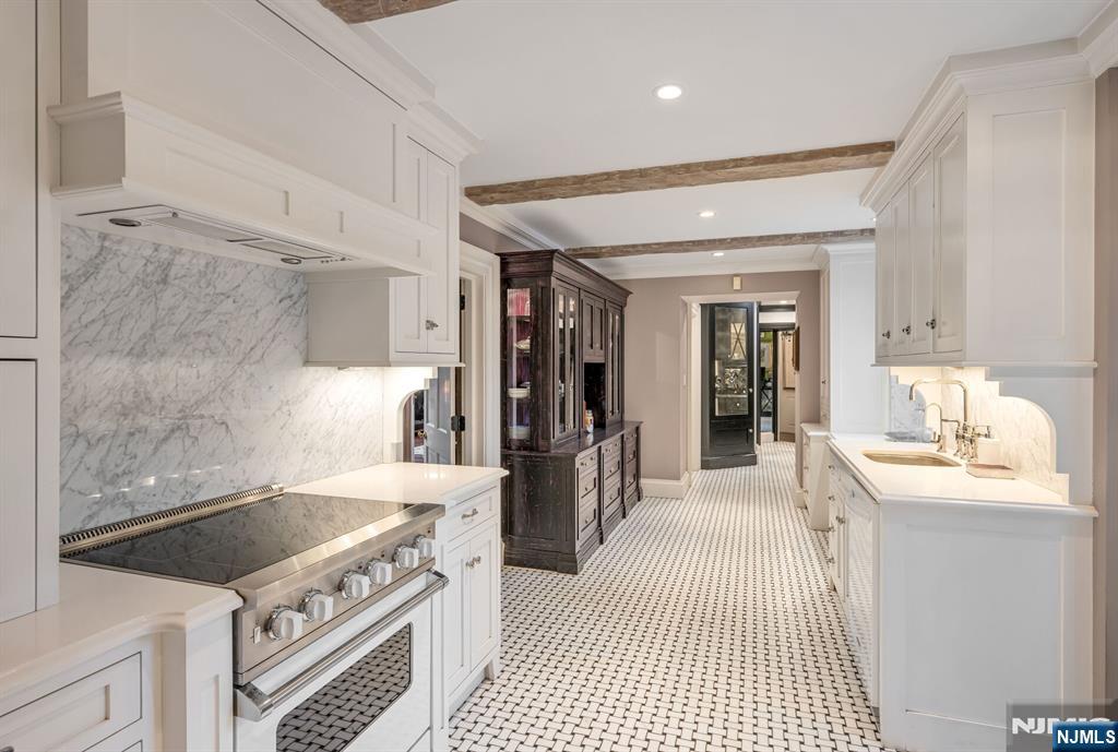 74 Village Road New Vernon, NJ 07976 - Photo 13 of 50 a kitchen with a stove and a sink