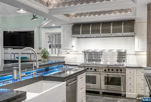 a kitchen with a stove and a sink