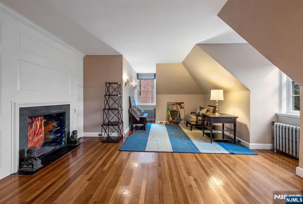 74 Village Road New Vernon, NJ 07976 - Photo 36 of 50 a living room with furniture and a fireplace