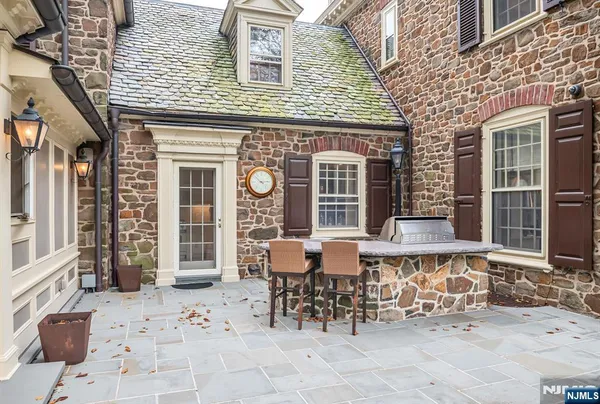 a view of a patio with table and chairs