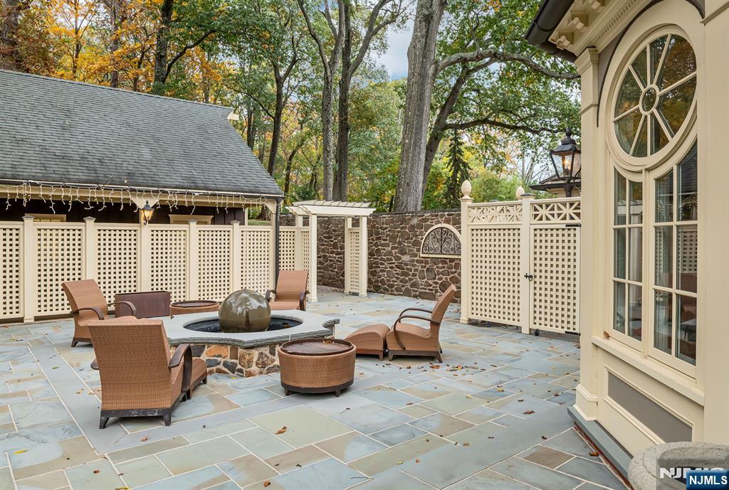 74 Village Road New Vernon, NJ 07976 - Photo 41 of 50 a view of a patio with table and chairs