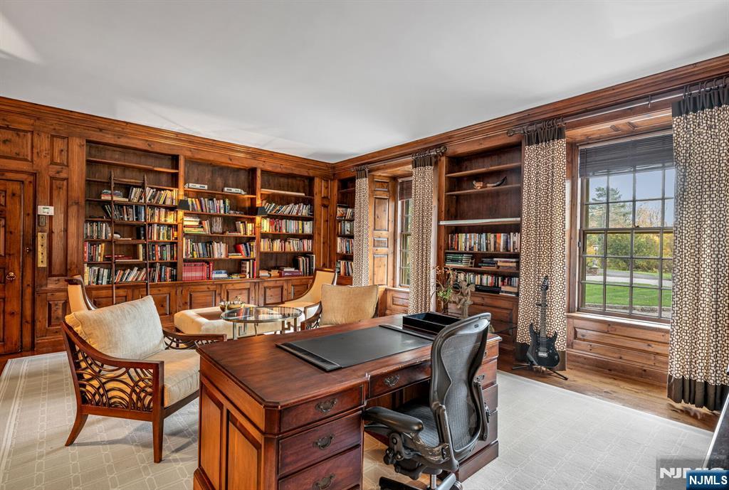 74 Village Road New Vernon, NJ 07976 - Photo 5 of 50 a view of a workspace with a bookshelf