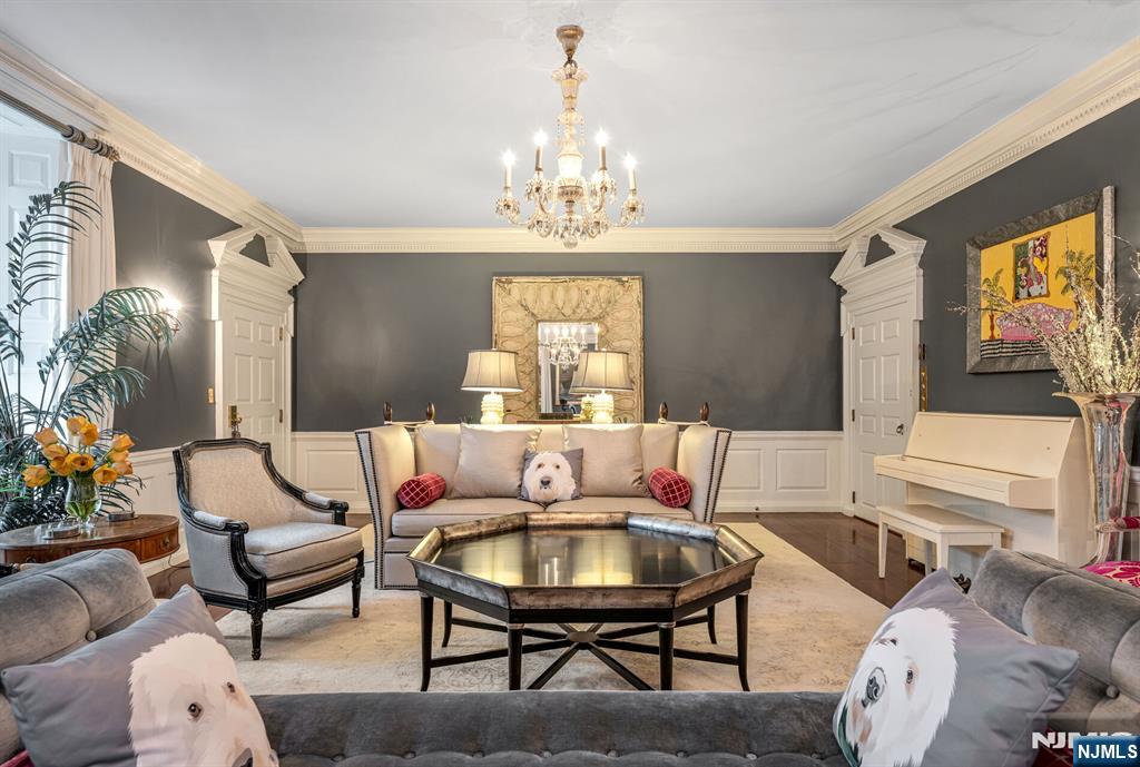 74 Village Road New Vernon, NJ 07976 - Photo 8 of 50 a living room with furniture a table and a chandelier