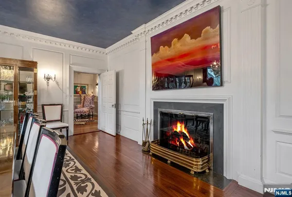 a living room with furniture fireplace and flat screen tv